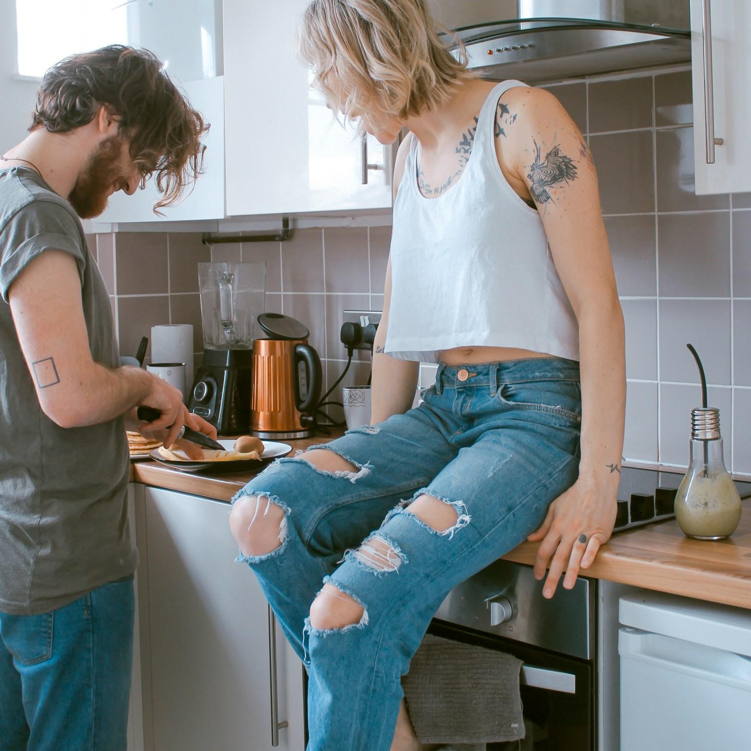 Diverse group of community members sharing a meal together, showcasing the social bonds formed through collaborative cooking